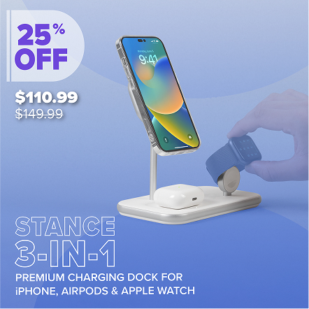 Phone charging stand by a window with a smartphone placed vertically.