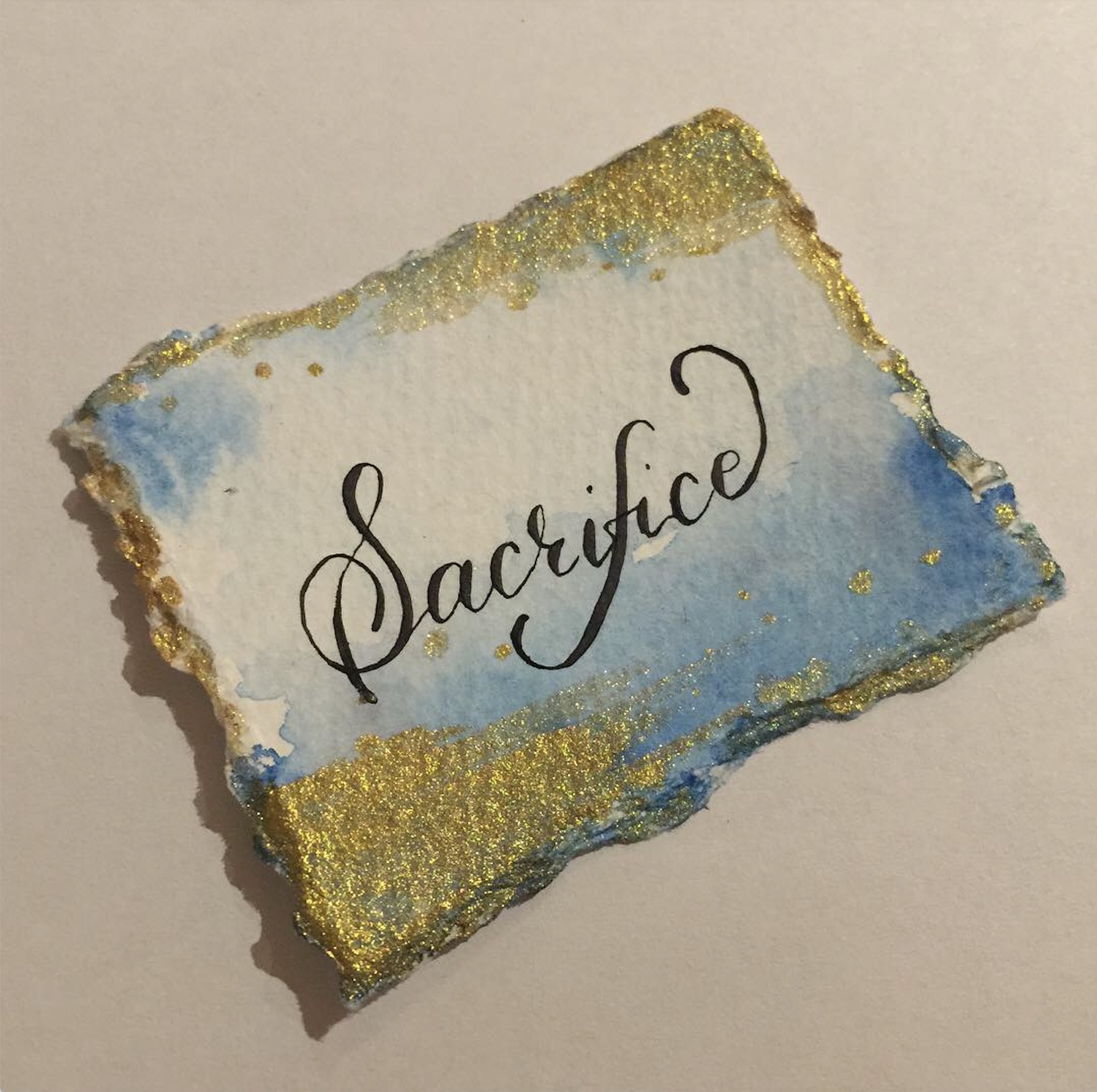 calligraphy with sacrifice word photo